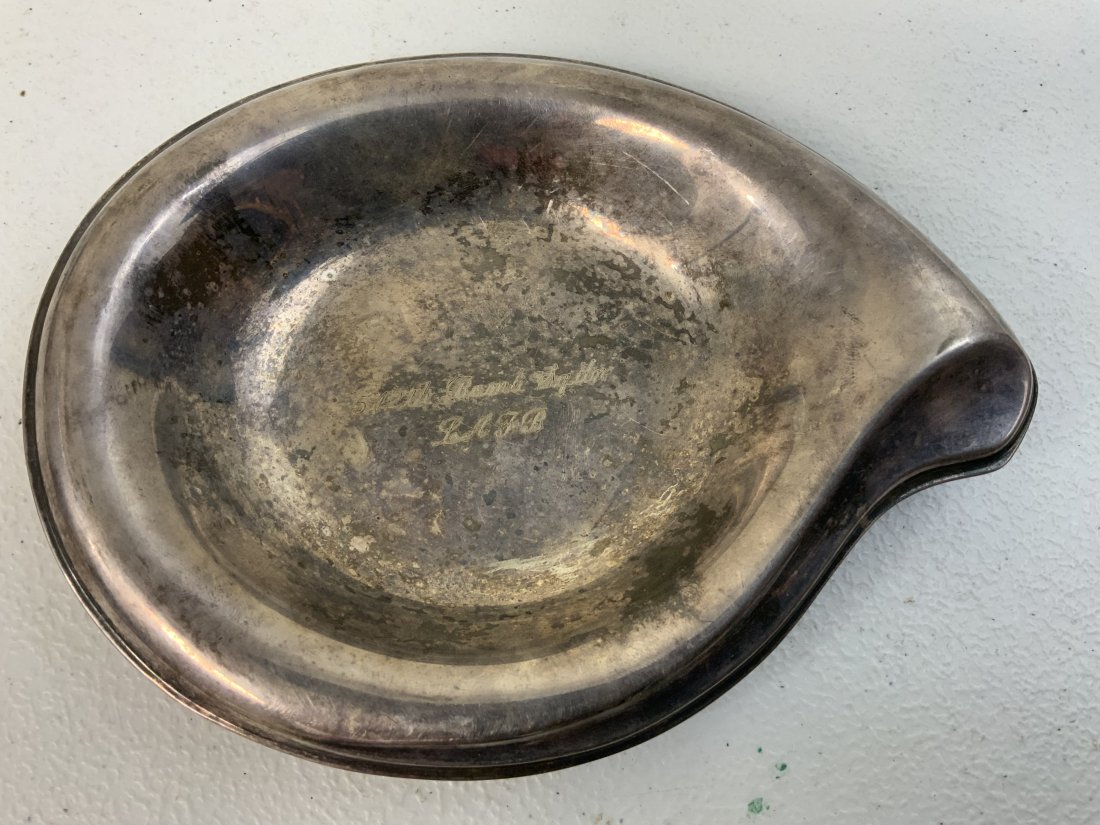 WWII US AIR FORCE 512th BOMB SQUADRON SILVER ASHTRAY: WWII US AIR FORCE 512th BOMB SQUADRON SILVER ASHTRAY . VERY NICE AND NEAT ITEM . ENGRAVED "512th Bomb Sqdr. LAFB" MARKED "FLAIR 1847 ROGER BROS ON THE BOTTOM. SIZE APPROX. 7 X 5