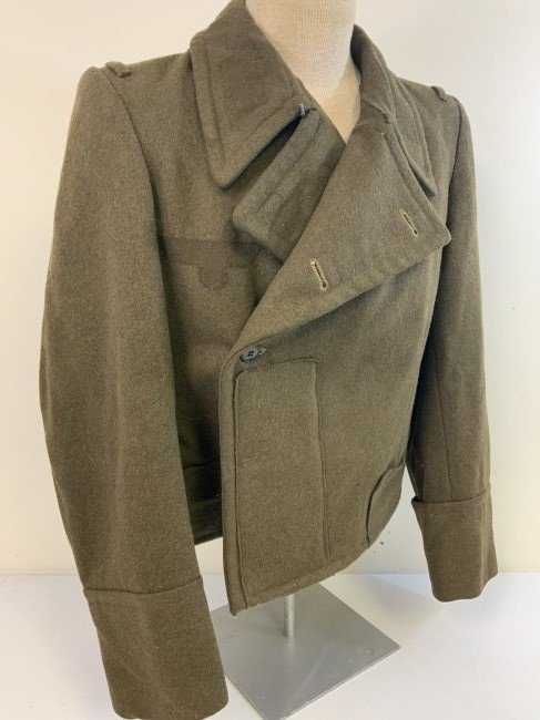 WWII GERMAN PANZER OR ASSAULT GUNNER UNIFORM WRAPPER LATE WAR CONVERSION: WWII GERMAN PANZER OR ASSAULT GUNNER UNIFORM WRAPPER LATE WAR CONVERSION . HEAVY THICK WOOL FIELD CONVERTED FROM AMERICAN WINTER OVERCOAT. NICELY DONE. ALL INSIGNIA HAS BEEN REMOVED BUT YOU CAN SEE TH