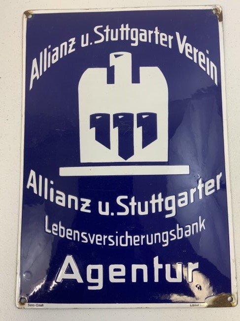 THIRD REICH GERMAN LIFE INSURANCE BANK AGENT PORCELAIN BUILDING SIGN: THIRD REICH GERMAN LIFE INSURANCE BANK AGENT PORCELAIN BUILDING SIGN. VERY GOOD CONDITION WITH ONLY MINOR CHIPS/RUST AROUND MOUNTING HOLES. VAULTED . 11 X 16 SIZE. RARE.