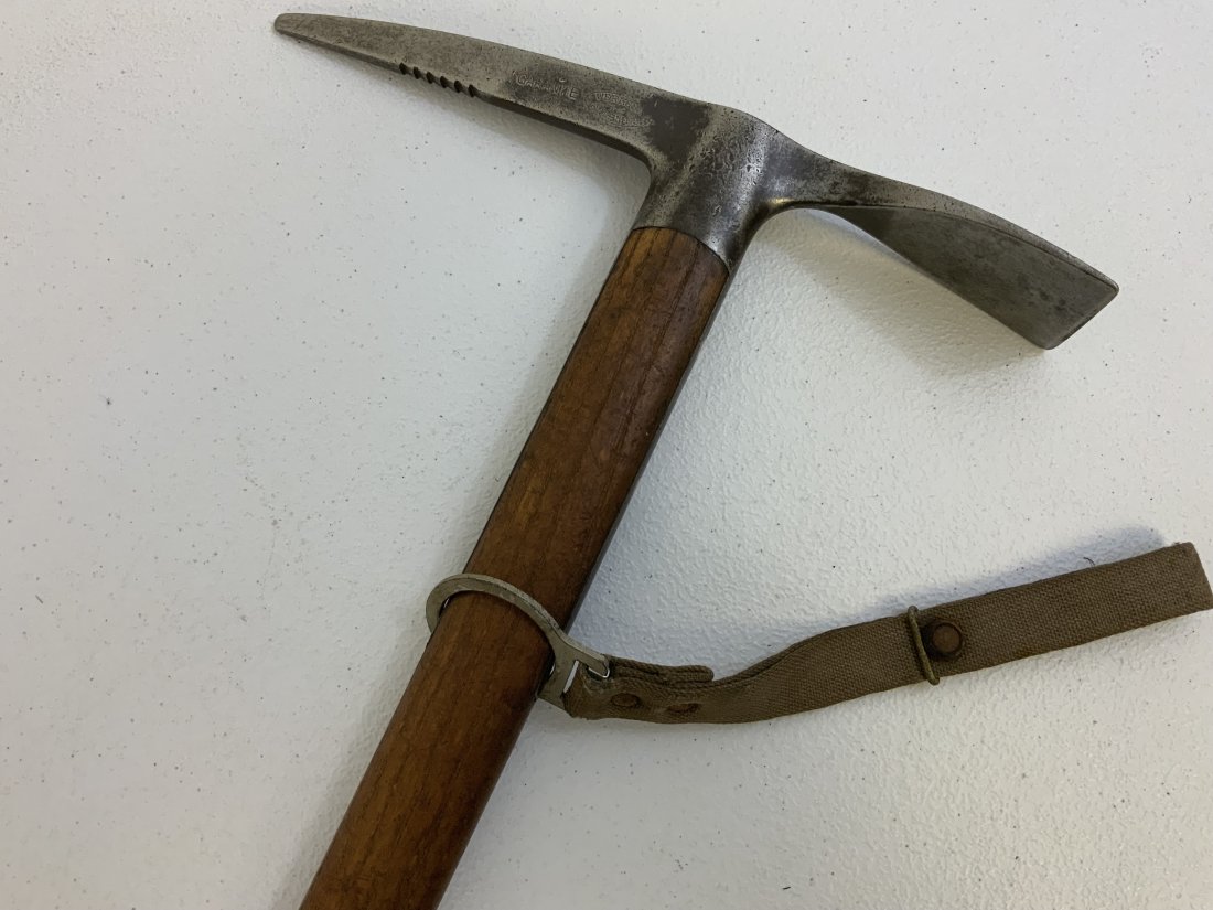 ANTIQUE WWI AUSTRIAN MOUNTAIN TROOPS ICE AXE PIC WITH BELT LOOP: ANTIQUE WWI AUSTRIAN MOUNTAIN TROOPS ICE AXE PIC WITH BELT LOOP. GREAT CONDITION ICE PICK TOOL . 37" LONG WITH 11" AXE PICK STEEL HEAD. MAKER MARKED. COMES WITH ORIGINAL CARRY BELT LOOP . RARE .