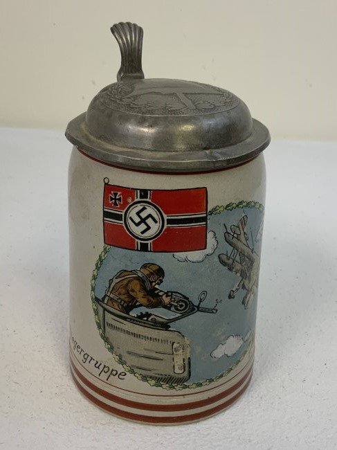 GERMANY THIRD REICH FLIEGERGRUPPE NAMED BEER MUG STEIN WITH LID: GERMANY THIRD REICH FLIEGERGRUPPE NAMED BEER MUG STEIN WITH LID . RARE TO FIND. GOOD CONDITION WITH NO CHIPS OR CRACKS. PEWTER LID WITH HELMET IMAGE WITH A SMALL DENT AT THE EDGE. .5 LITER CAPACITY . 