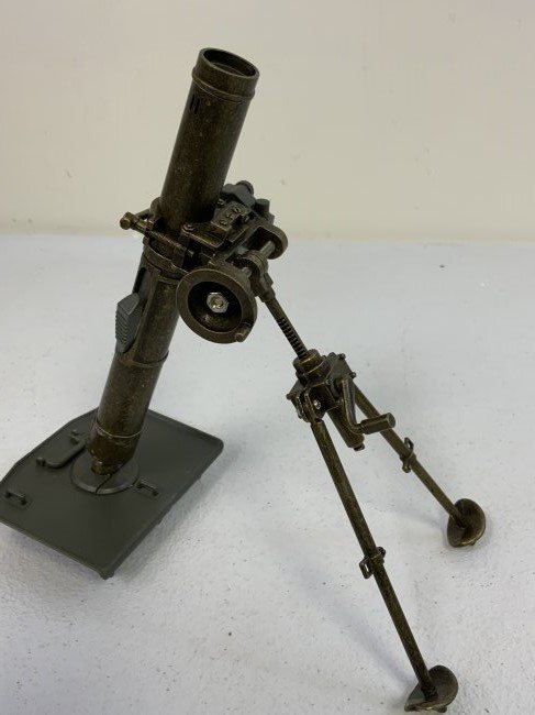 TABLE TOP MORTAL MODEL METAL LIGHTER ON PLASTIC BASE.: TABLE TOP MORTAL MODEL METAL LIGHTER ON PLASTIC BASE. WORKS FINE . GREAT DECORATOR. 8" TALL.