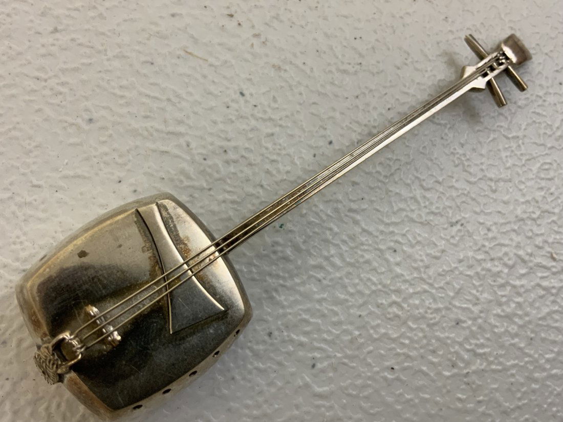 ANTIQUE JAPANESE SILVER MUSICAL INSTRUMENT PILL POWDER BOX: ANTIQUE JAPANESE SILVER MUSICAL INSTRUMENT PILL POWDER BOX . MARKED. 4 1/4' LONG.