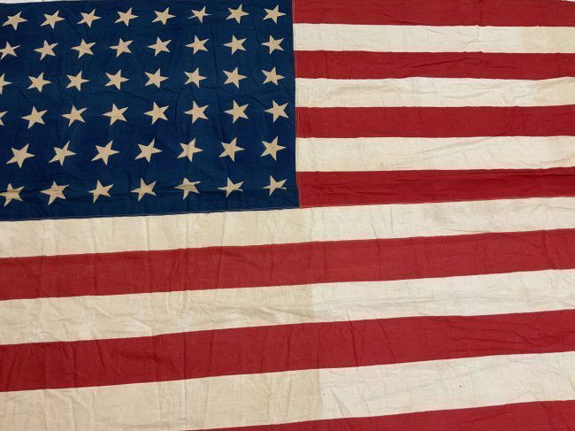 USA VINTAGE WWII ERA 48 STAR AMERICAN FLAG: USA VINTAGE WWII ERA 48 STAR AMERICAN FLAG . LARGE SIZE 116 X 61 . NAME EMBROIDERED . SHOWS AGE AND USE.