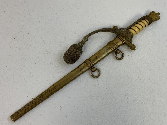 WWII GERMAN NAVY KRIEGSMARINE OFFICERS DAGGER PAUL WEYERSBERG: WWII GERMAN NAVY KRIEGSMARINE OFFICERS DAGGER PAUL WEYERSBERG . GOOD CONDITION OVERALL. NICE ETCHED BLADE WITH MAKERS MARK. ORIGINAL KNOT TIED IN CORRECT MANNER . SOME CRACKS TO THE GRIP. RELEASE BUTT