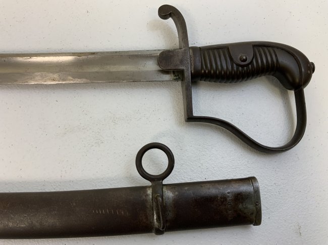 ANTIQUE IMPERIAL GERMAN 1873 ARTILLERY SWORD REGIMENTAL STAMPED: IMPERIAL GERMANY 1873 ARTILLERY SWORD REGIMENTAL STAMPED . GREAT CONDITION FOR ITS AGE . MATCHING REGIMENTAL STAMPING ON THE SWORD AND SCABBARD . 1912 DATE ON THE SPINE. GREAT EXAMPLE .