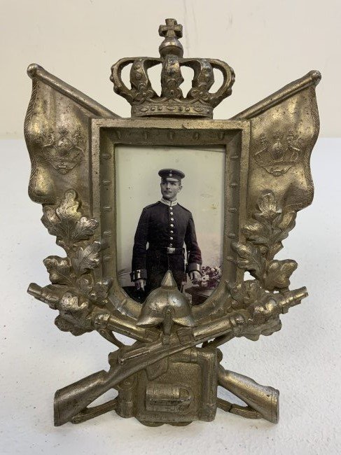 ANTIQUE IMPERIAL GERMAN MILITARY SERVICE MEMORIAL FRAMED PICTURE: ANTIQUE IMPERIAL GERMAN BAVARIA MILITARY SERVICE MEMORIAL FRAMED PICTURE. METAL FRAME WITH STAND. D.R.G.M. MARKED . PICTURE OF THE SOLDIER UNDER THE GLASS. BEAUTIFUL PIECE. APPROX. 8 X 6.