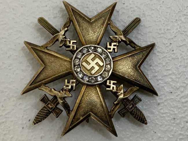 WWII NAZI GERMANY SPANISH CROSS IN GOLD WITH SWORDS WITH DIAMONDS: WWII NAZI GERMANY SPANISH CROSS IN GOLD WITH SWORDS WITH DIAMONDS . BELIEVED TO BE A WEARERS EXAMPLE WITH FAUX DIAMONDS. BEAUTIFUL HIGH QUALITY MADE . 800 SILVER AND GILDED . JUNKERS MAKER MARK STAMP 