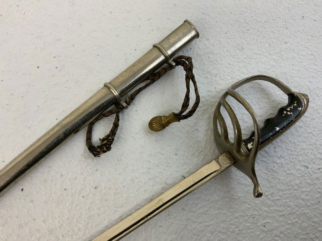 VINTAGE US ARMY OFFICER MINIATURE SWORD LETTER OPENER: VINTAGE US ARMY OFFICER MINIATURE SWORD LETTER OPENER. GREAT CONDITION WITH SWORD KNOT. MARKED GERMANY . 10" LONG