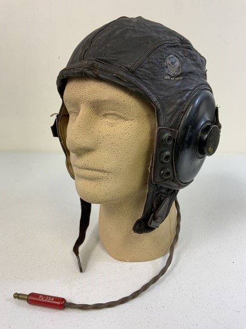 WWII US ARMY AIR FORCE NAMED FLIGHT LEATHER HELMET: WWII US ARMY AIR FORCE NAMED FLIGHT LEATHER HELMET . NICE AND COMPLETE WITH EARPHONES AND WIRED . NICELY MARKED WITH ORIGINAL OWNERS NAME INSIDE. ONE HOLE ON TOP OTHERWISE GREAT CONDITION AND COMPLETE