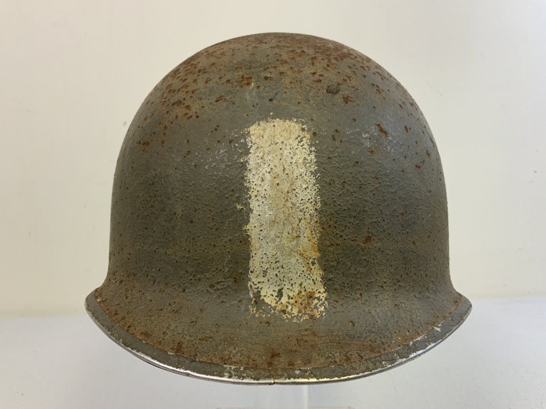 WWII US M1 FIXED BALE STEEL HELMET WITH CAPAC LINER: WWII US M1 FIXED BALE STEEL HELMET . FRONT SEAM STAINLESS STEEL RIM. SOME CORROSION. ONE VERTICAL BAR PAINTED ON THE FRONT. LOOKS LIKE ONE BULLET HOLE ON TOP. NICE CAPAC LINER WITH INTERNAL WEBBING.