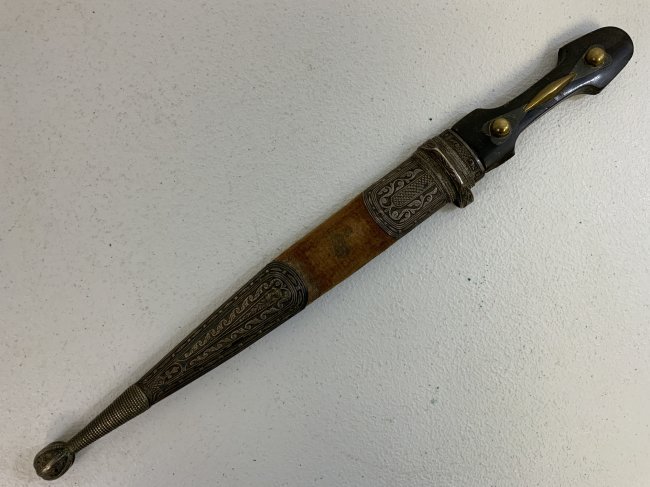 ANTIQUE RUSSIAN COSSACK CAUCASIAN KINJAL DAGGER SILVER NIELLO FITTINGS: ANTIQUE RUSSIAN COSSACK CAUCASIAN KINJAL DAGGER . NICE BLADE WITH MAKER STAMP. SILVER NIELLO DECORATED FITTINGS ON THE SCABBARD . SIGNED IN ARABIC WITH LOOKS LIKE 1914 DATE . 16" LONG WITH 10" BLADE.