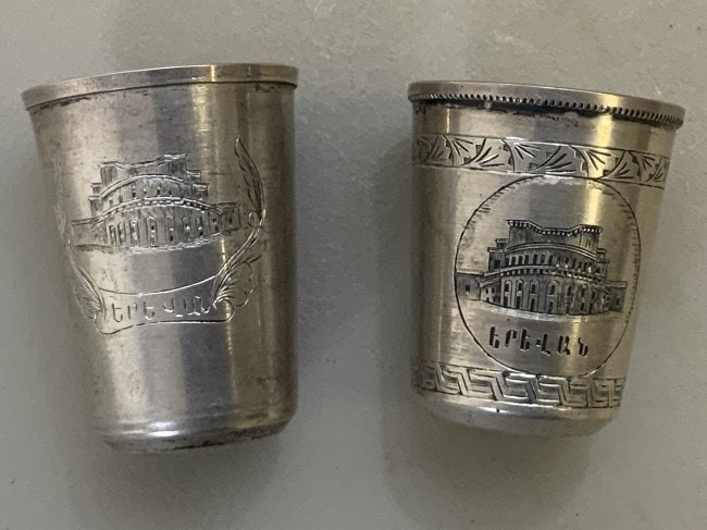 VINTAGE USSR SOVIET ARMENIA SILVER VODKA DRINKING CUPS: VINTAGE USSR SOVIET ARMENIA SILVER VODKA DRINKING CUPS .RARE FINE SOVIET ARMENIA 875 SILVER WITH GOLD WASH ENGRAVED CUPS DEPICTING YEREVAN OPERA AND BALLET THEATRE. HALLMARKED WITH RUSSIAN SILVER MARK