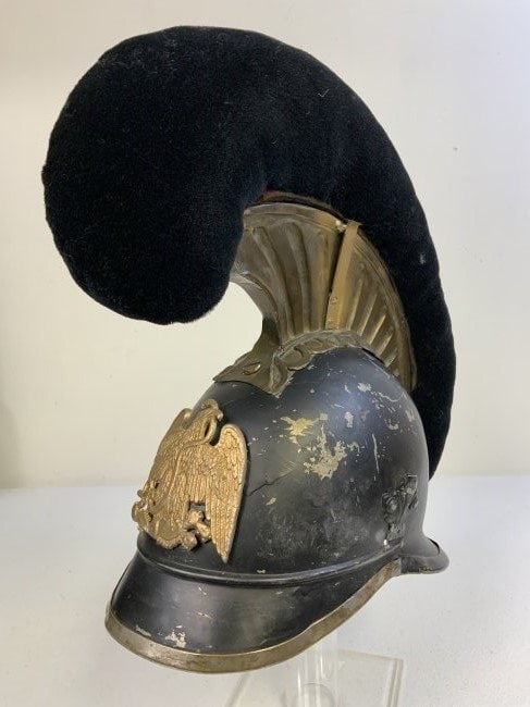 ANTIQUE CAVALRY DRAGOON STYLE HELMET: ANTIQUE CAVALRY DRAGOON STYLE HELMET . BLACK METAL BODY . FRONT PLATE APPEARS TO BE ADDED LATER AND LOOKS LIKE MEXICAN EAGLE . WELL USED AND SHOWS WEAR AND AGE . NICE DISPLAY PIECE.