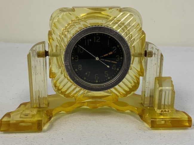 USSR TANK CLOCK INSTALLED IN ART DECO STYLE PLASTIC DISPLAY STAND: USSR TANK CLOCK INSTALLED IN ART DECO STYLE PLASTIC DISPLAY STAND. VERY NICE DISPLAY PIECE. THE CLOCK IS IN FULL WORKING CONDITION. 7 1/2" X 5" STAND. 2 1/2" DIAM. CLOCK.