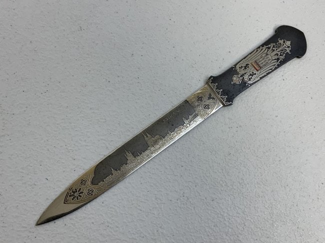 VINTAGE HENCKELS LETTER OPENER WITH CITY OF KOLN ENGRAVING: VINTAGE HENCKELS LETTER OPENER WITH CITY OF KOLN ENGRAVING. ENGRAVING ETCHING BLUED -BEAUTIFUL CONDITION HIGH QUALITY MADE . 9 1/4 LONG.