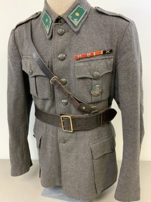 WWII FINLAND OFFICERS UNIFORM TUNIC RARE WW2 FINISH: WWII FINLAND OFFICERS UNIFORM TUNIC AND BELT . VERY RARE FIND. COMPLETE WITH BADGE AND MEDAL RIBBON BAR. INK STAMPED INSIDE . ALSO FIELD DRESSING FOUND IN THE POCKET. NICE CONDITION.