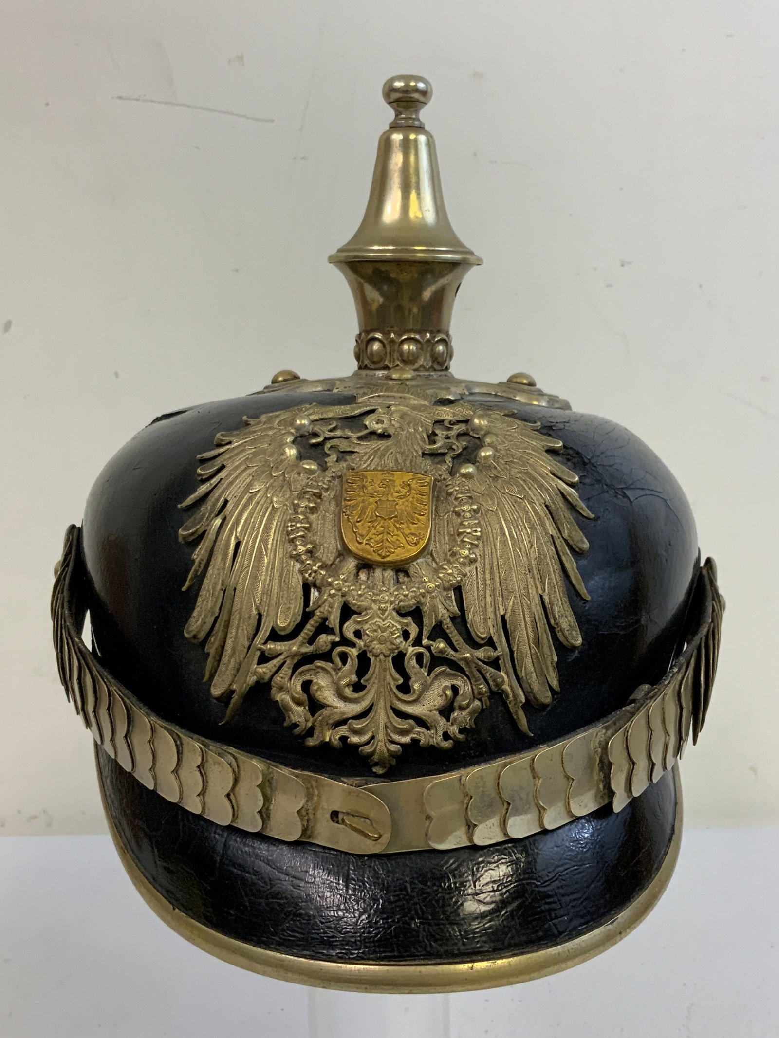 IMPERIAL GERMANY PRUSSIAN POLICE OFFICER LEATHER SPIKE HELMET: IMPERIAL GERMANY PRUSSIAN POLICE OFFICER LEATHER SPIKE HELMET. OVERALL VERY GOOD CONDITION WITH SILVER FINISH FITTINGS. LEATHER BODY OVERALL IS NICE WITH ONE CRAZING AREA BUT DISPLAYS VERY NICE. HIGH