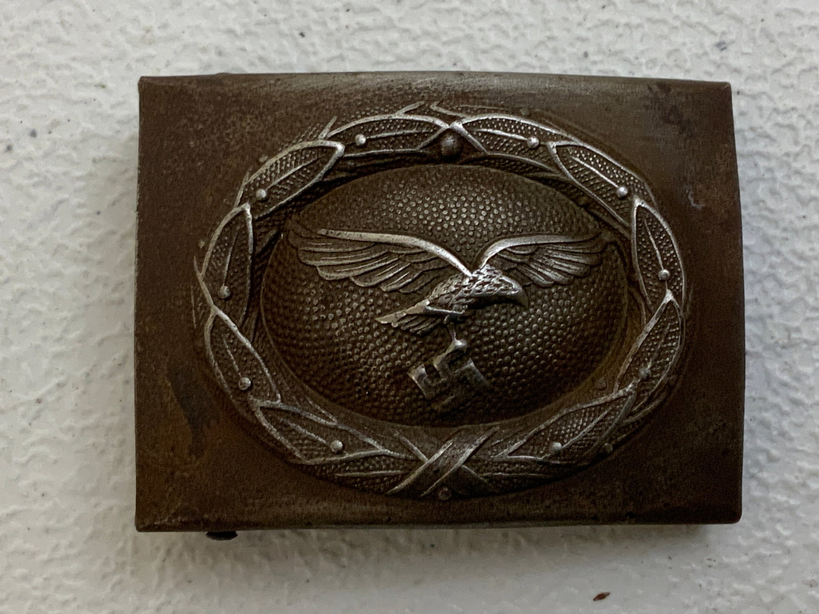 WWII GERMAN LUFTWAFFE EM BELT BUCKLE: WWII GERMAN LUFTWAFFE EM BELT BUCKLE. WORN CONDITION WITH SOME RUST. MAKER MARKED.