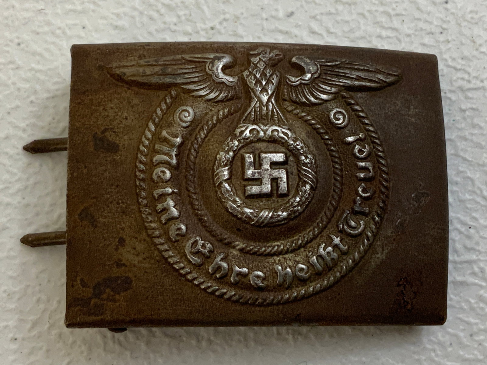 WWII GERMAN SS EM BELT BUCKLE: WWII GERMAN SS EM BELT BUCKLE. WORN CONDITION WITH SOME RUST. MAKER MARKED RZM 36/42 SS.