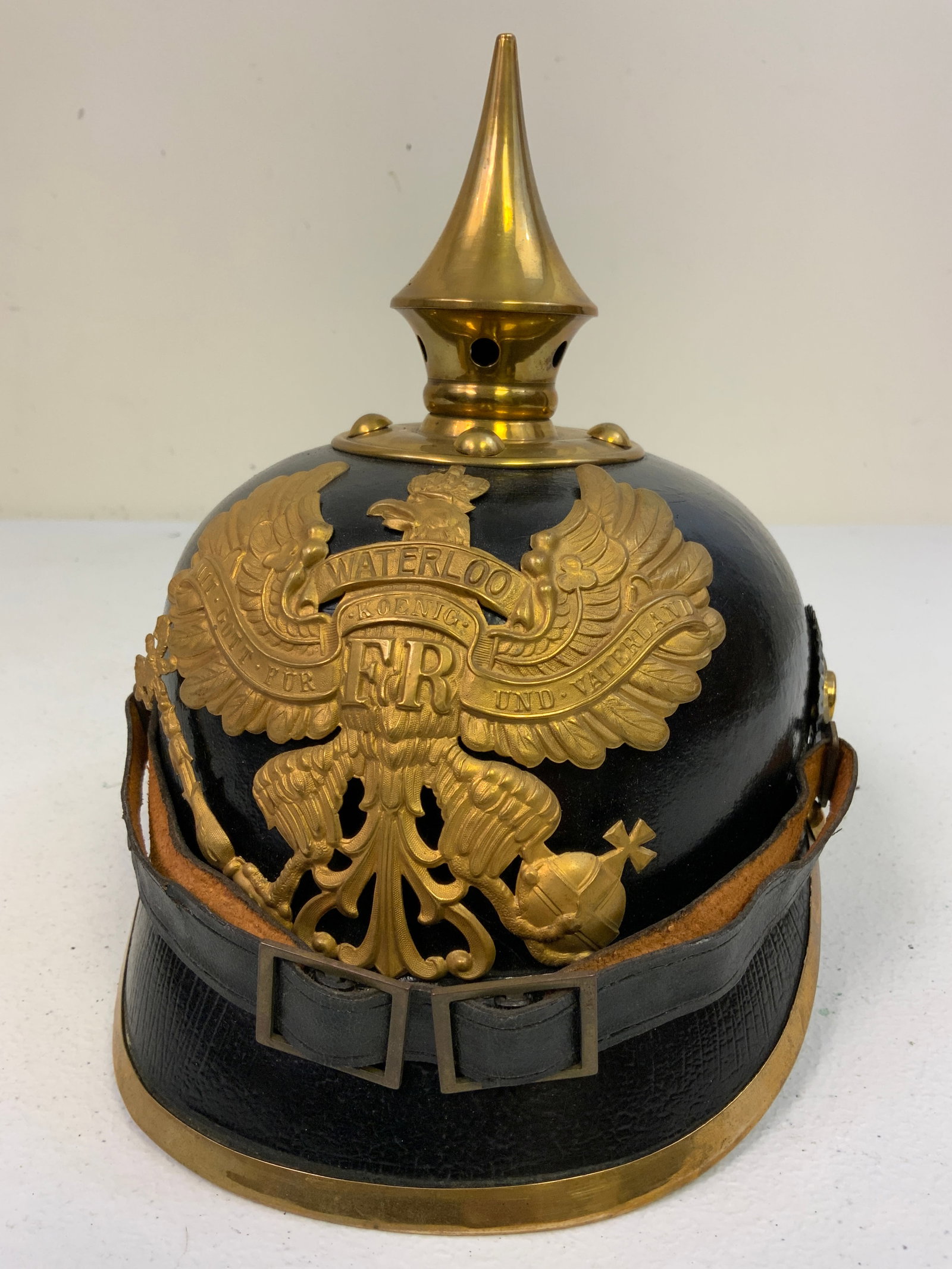 IMPERIAL GERMANY PRUSSIAN ENLISTED PICKELHAUBE SPIKE HELMET: IMPERIAL GERMANY PRUSSIAN ENLISTED PICKELHAUBE SPIKE HELMET . PRE WAR PARADE HELMET WITH BRASS FITTINGS. GREAT OVERALL CONDITION COMPLETE WITH CHINSTRAP AND COCKADES. NAME AND REGIMENTAL MARKINGS INSI