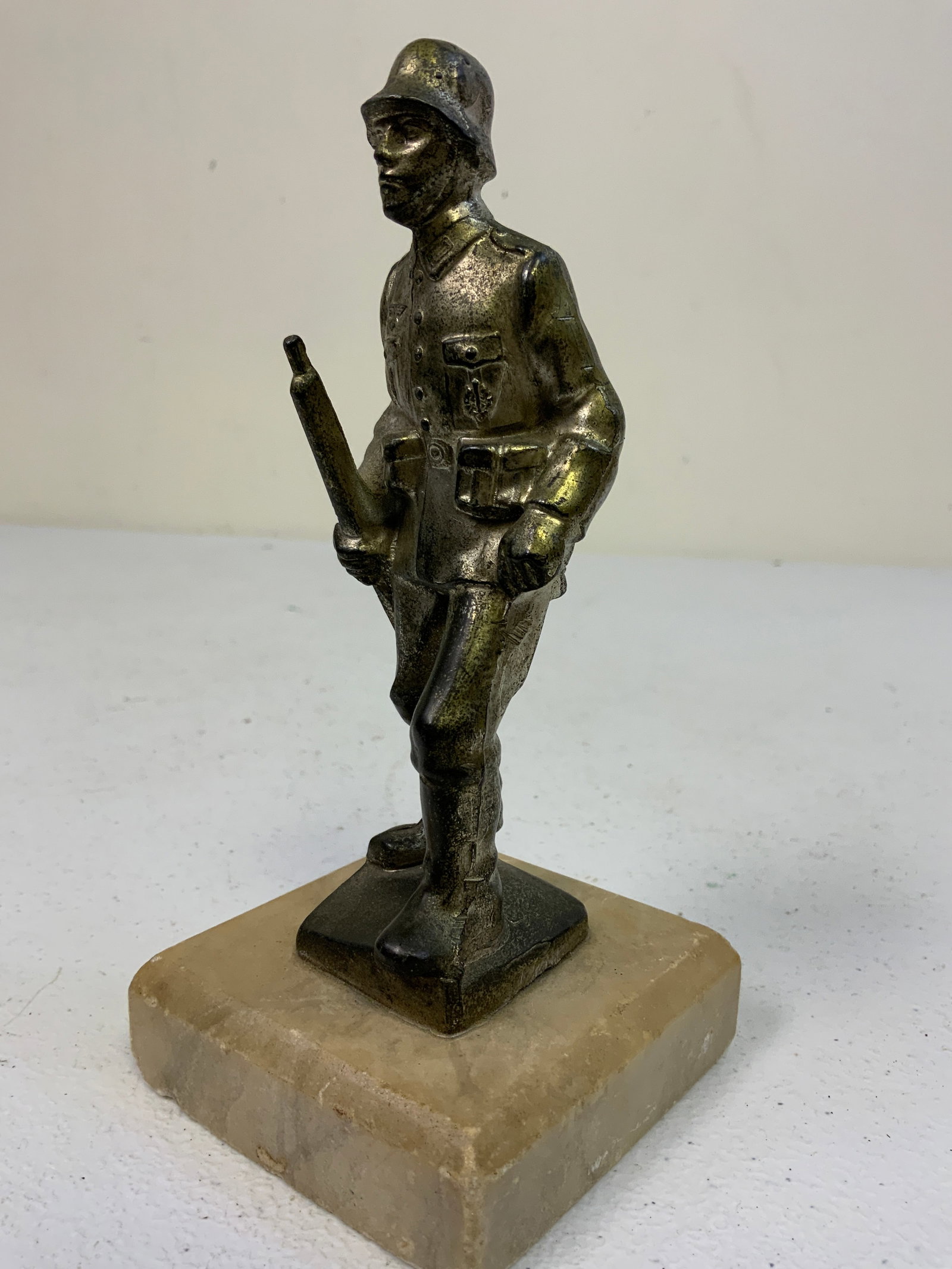 GERMANY THIRD REICH ARMY SILDIER STATUE ON MARBLE BASE: GERMANY THIRD REICH ARMY SILDIER STATUE ON MARBLE BASE . 6" TALL ON 3X3 BASE.