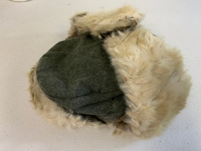 WWII GERMAN MILITARY COLD WEATHER RUSSIAN FRONT FUR HAT: WWII GERMAN MILITARY COLD WEATHER RUSSIAN FRONT FUR HAT. USED BY ARMY AND WAFFEN SS DURING WINTER ON RUSSIAN FRONT. NICELY MARKED INSIDE WITH 1942 DATE. SOME MOTHING TO A WOOL PART. OTHERWISE VERY GOO