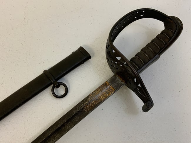 IMPERIAL GERMANY HESSEN INFANTRY OFFICERS M 1854 SWORD WITH DAMASCUS BLADE: IMPERIAL GERMANY HESSEN INFANTRY OFFICERS M 1854 SWORD WITH DAMASCUS BLADE. RARE TO FIND HESSEN OFFICERS SWORD FROM LATE 19TH CENTURY. BLADE IS DARK WITH AGE AND HAS GOLD TONE FINISHED ETCHING ON THE 