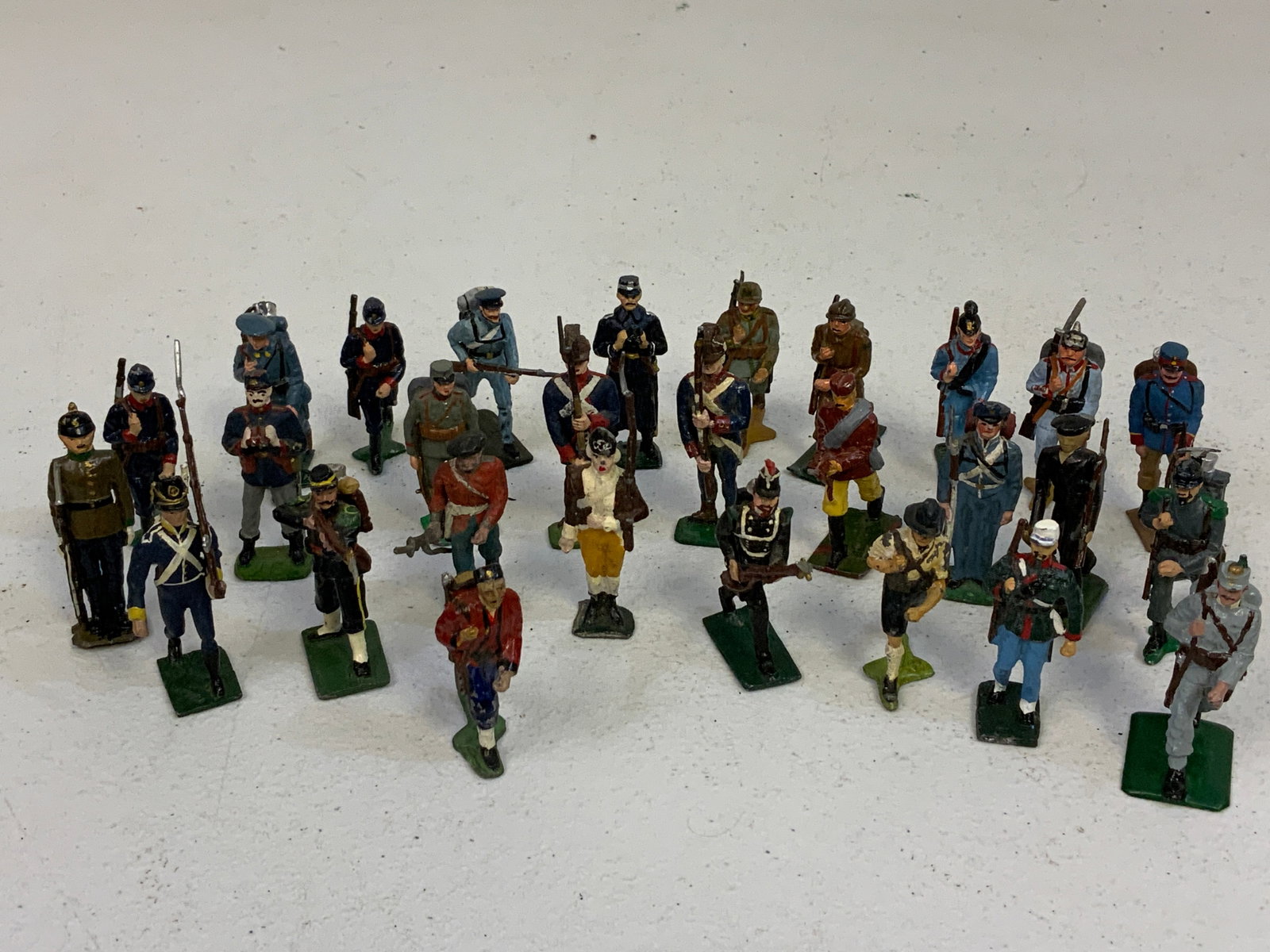 LOT OF PAINTED LEAD TOY SOLDIERS: LOT OF PAINTED LEAD TOY SOLDIERS . LOT OF 28 . 2" TALL.