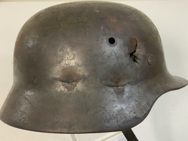 WWII GERMAN BATTLE DAMAGED M39 ARMY COMBAT HELMET WITH LINER AND CHIN STRAP