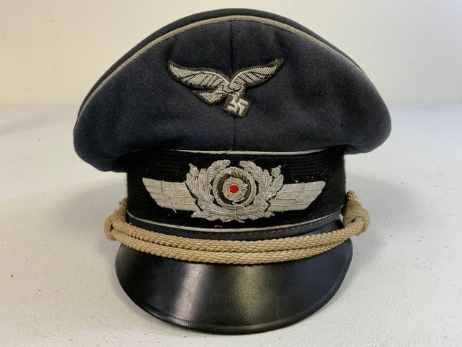WWII GERMAN LUFTWAFFE OFFICER VISOR CAP: WWII GERMAN LUFTWAFFE OFFICER VISOR CAP . GOOD OVERALL CONDITION CAP WITH SILVER WIRE EMBROIDERED INSIGNIA.