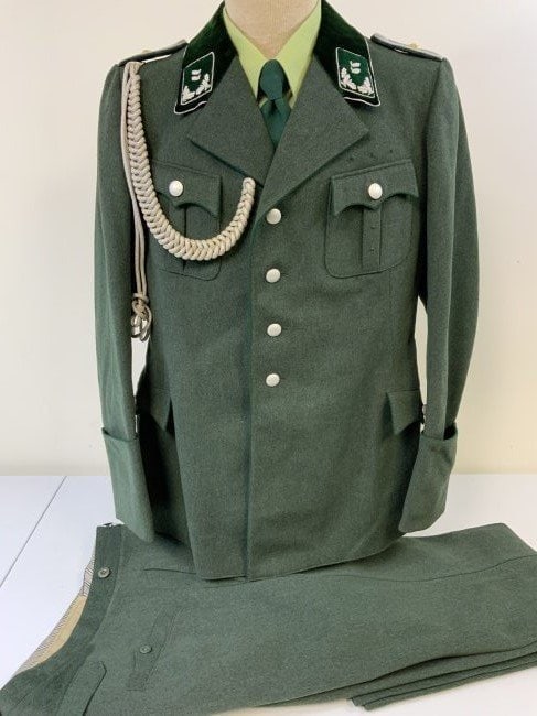 GERMANY THIRD REICH FORESTRY OFFICER DRESS UNIFORM WITH PANTS 1937 DATED: GERMANY THIRD REICH FORESTRY OFFICER DRESS UNIFORM. COMPLETE WITH PANTS AND POST WAR GREEN SHIRT AND TIE FOR DISPLAY . MINTY CONDITION DRESS TUNIC WITH DRESS SILVER CORD AIGUILLETTES. NAMED AND DATED 