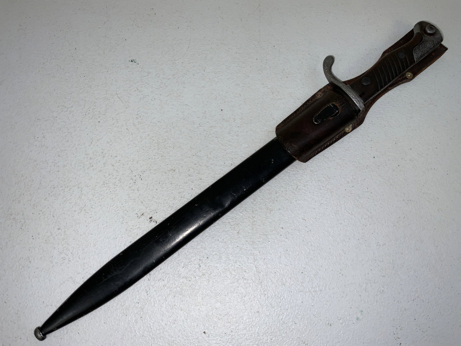 RARE GERMAN EARLY NAZI POLICE BAYONET MADE FROM IMPERIAL BUTCHER BLADE: RARE GERMAN EARLY NAZI POLICE BAYONET MADE FROM IMPERIAL BUTCHER BLADE EXAMPLE. WAFFENFABRIK MAUSER 1916 ORIGINAL BAYONET CONVERTED DURING EARLY NAZI PERIOD BY RESHAPING A BLADE AND ENGRAVING THE FITT