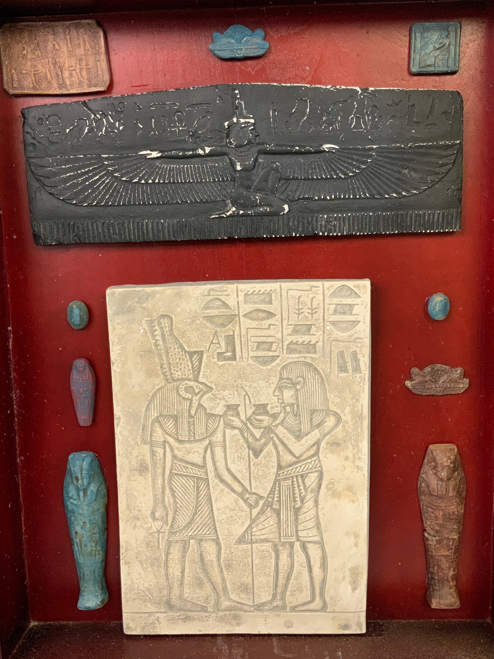 EGYPTIAN DECORATING OBJECTS FRAMED IN SHADOW BOX: EGYPTIAN DECORATING OBJECTS FRAMED IN SHADOW BOX. 20X6 SIZE OF THE CASE.FROM DR. PAUL D WYNN COLLECTION .