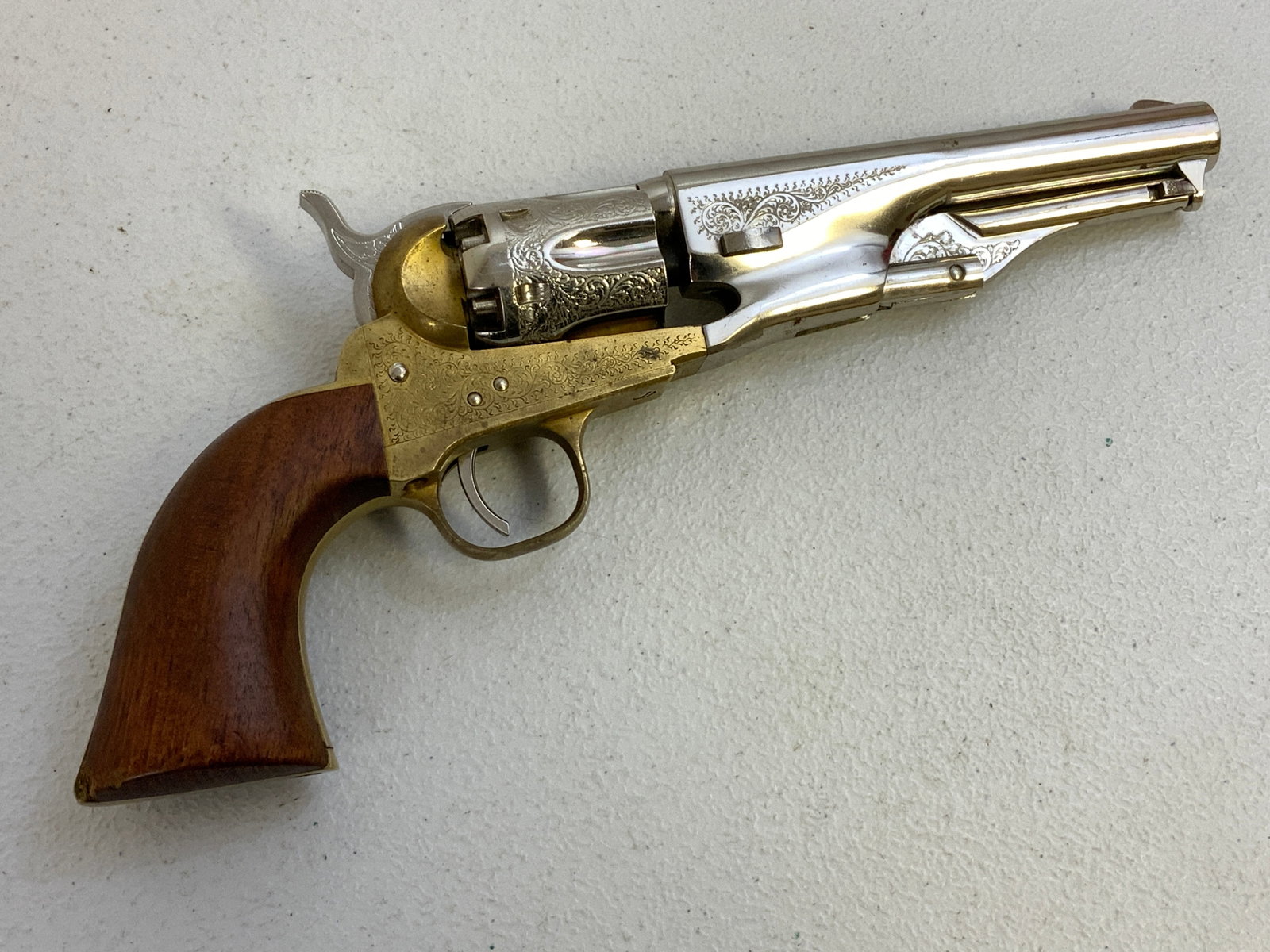 ITALIAN REPRODUCTION COLT REVOLVER ENGRAVED NICKEL PLATED FINISH: ITALIAN REPRODUCTION COLT REVOLVER ENGRAVED NICKEL PLATED FINISH. BEAUTIFUL PIECE. .44 CAL. ACTION WORKS PERFECT. 12" LONG. USA BIDDERS ONLY.