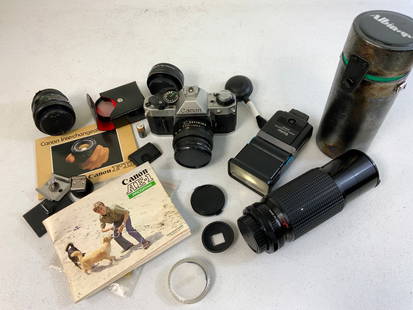 VINTAGE CANON AE-1 35MM FILM CAMERA WITH ACCESSORIES: VINTAGE CANON AE-1 35MM FILM CAMERA WITH ACCESSORIES. APEARS TO BE IN GREAT CONDITION. INCLUDES ALL PICTURED ACCESSORIES.
