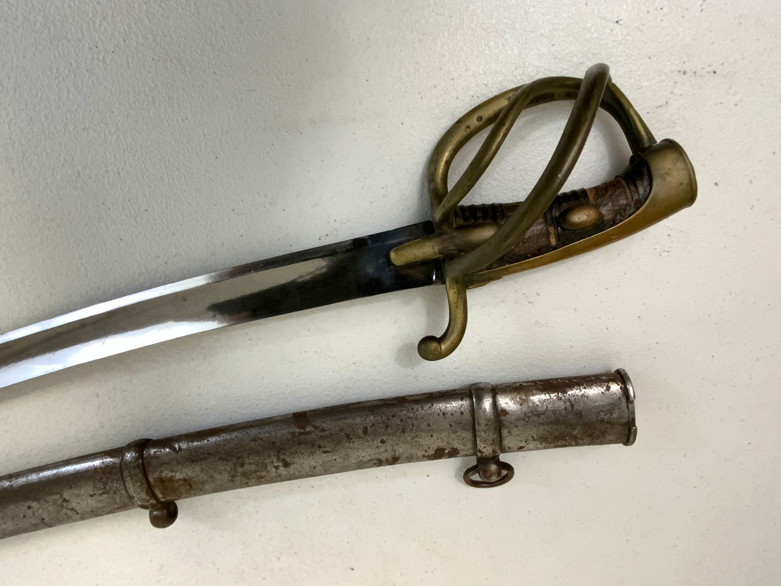 ANTIQUE FRENCH NAPOLEONIC ERA HUSSAR SWORD: ANTIQUE FRENCH NAPOLEONIC ERA HUSSAR SWORD. GREAT CONDITION FOR ITS AGE. DATED 1911. BRIGHT NICKEL PLATED BLADE. BRASS GUARD . WEAR TO THE LEATHER COVERED GRIP. METAL SCABBARD. 41" LONG WITH 34 1/2" L