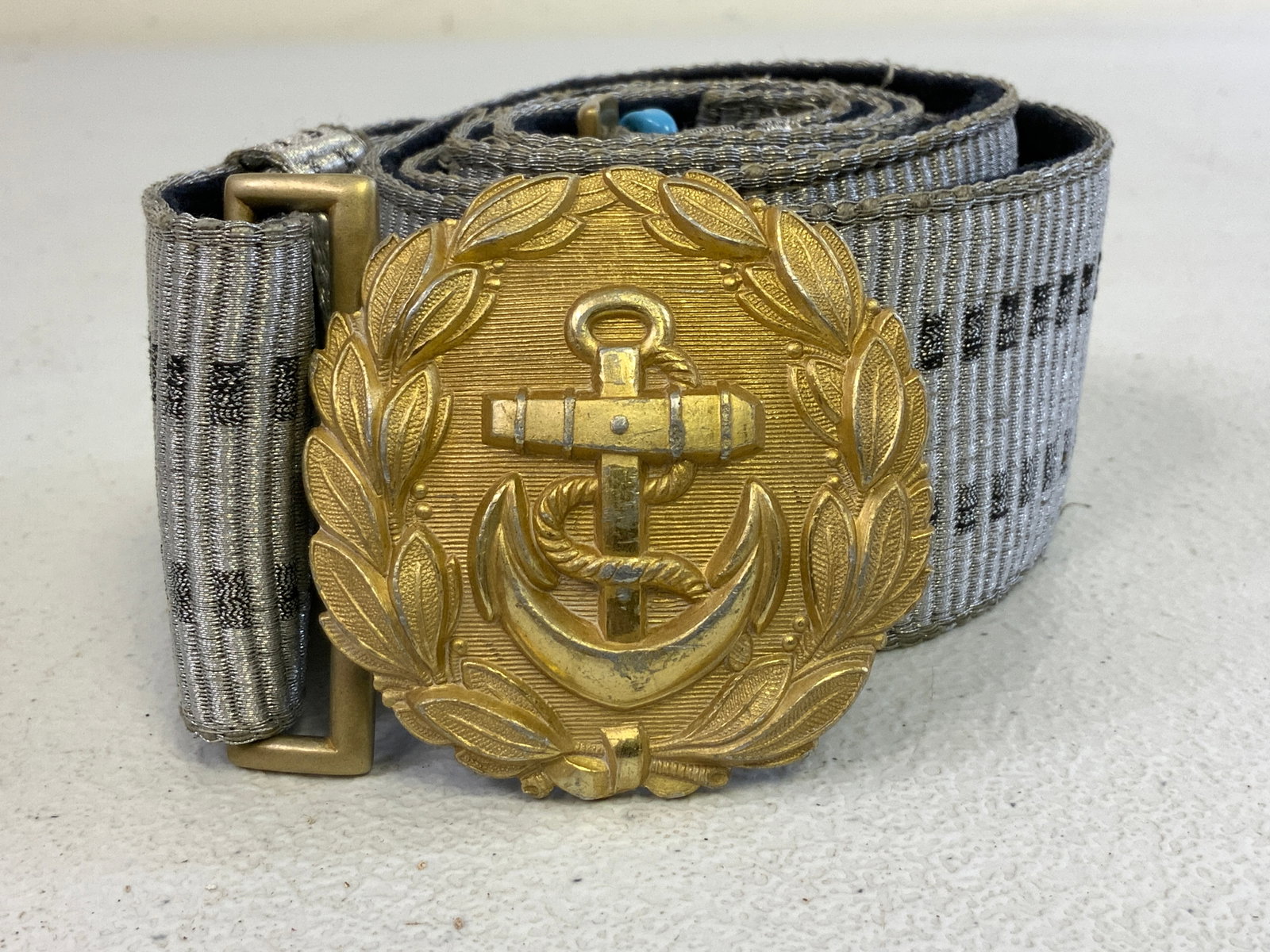 GERMANY THIRD REICH KRIEGSMARINE OFFICER DRESS BELT WITH BUCKLE: GERMANY THIRD REICH KRIEGSMARINE OFFICER DRESS BELT WITH BUCKLE. GREAT CONDITION. LOOPS FOR SWORD HANGERS. GILDED BUCKLE MAKER MARKED.
