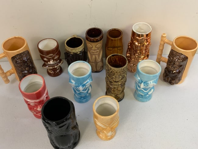 LARGE LOT OF HAWAIIAN STYLE TIKI CUPS AND VASES: LARGE LOT OF HAWAIIAN STYLE TIKI CUPS AND VASES . FORM DR. PAUL LYNN COLLECTION .
