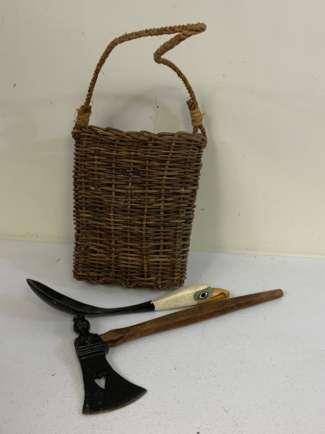 NATIVE AMERICAN BRITISH COLUMBIA HAIDA TRIBE ANTIQUES LOT: NATIVE AMERICAN BRITISH COLUMBIA HAIDA TRIBE ANTIQUES LOT. WOVEN BASKET WITH SHOULDER STRAP C.1800 9 12" LONG , TOMAHAWK PIPE C.1900 13" LONG AND FEAST SPOON C.1900 12" LONG. FROM DR. PAUL LYNN COLLEC