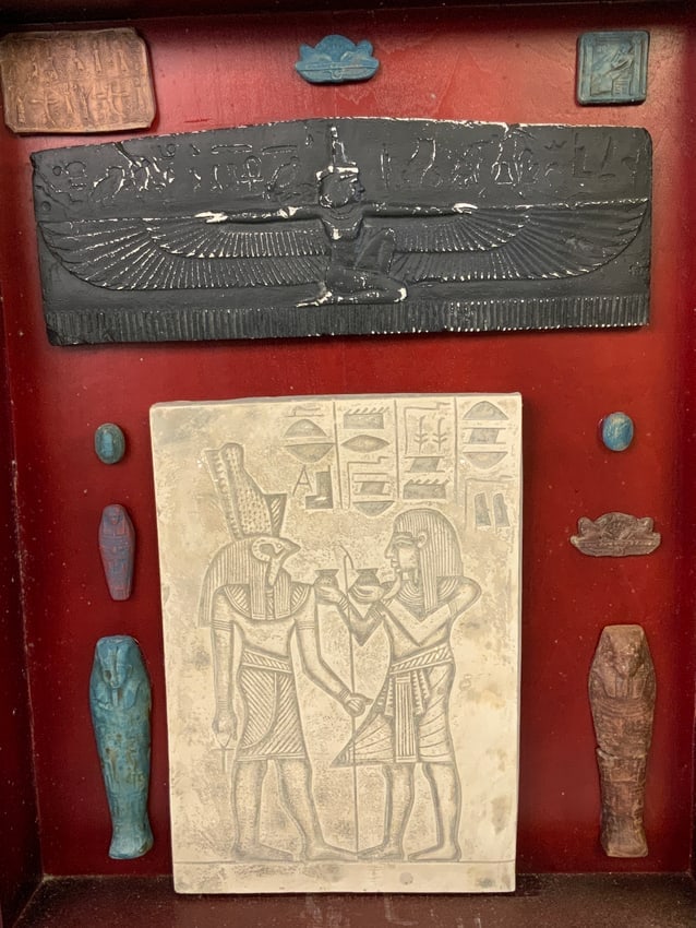 EGYPTIAN DECORATING OBJECTS FRAMED IN SHADOW BOX: EGYPTIAN DECORATING OBJECTS FRAMED IN SHADOW BOX. 20X6 SIZE OF THE CASE.FROM DR. PAUL D WYNN COLLECTION .