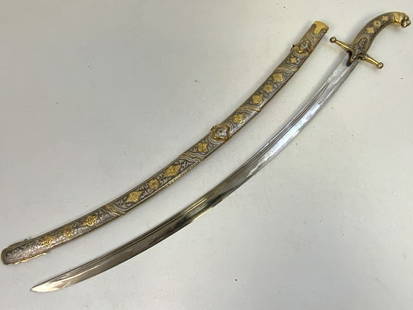 RUSSIAN DAGESTAN GILDED SILVER NIELLO DECORATED SWORD: RUSSIAN DAGESTAN GILDED SILVER NIELLO DECORATED SWORD. VERY NICE GILDED SILVER DECORATED WITH NIELLO FITTINGS. VERY NICE CURVED BLADE CLEAN AND BRIGHT. 35" LONG WITH 29" LONG BLADE.