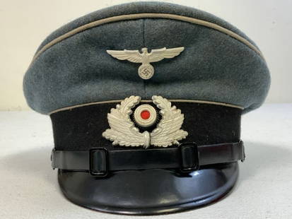 WWII GERMAN BAHNSCHUTZ POLIZEI NCO OFFICER VISOR HAT: WWII GERMAN BAHNSCHUTZ POLIZEI NCO OFFICER VISOR HAT. RARE AND MINT CONDITION HAT. SIZE 56 1/2 . LIGHT BLUE WOOL BODY WITH ALUMINUM INSIGNIA. COMPLETE WITH LEATHER CHIN STRAP. RARE HAT.