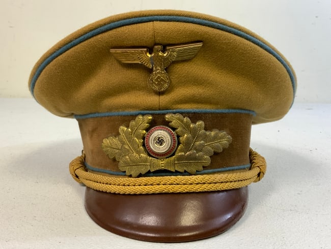 GERMANY THIRD REICH GERMAN NSDAP NAMED POLITICAL LEADER VISOR CAP: GERMANY THIRD REICH GERMAN NSDAP ORTSGRUPPE LEVEL NAMED POLITICAL LEADER VISOR CAP . VERY NICE CAP . BLUE PIPED .SIZE ABOUT 58 . NICE RZM TAG INSIDE AND NAME INSERT. NICE SADDLE SHAPE. GREAT EXAMPLE.