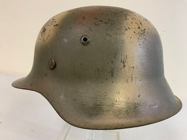 THIRD REICH GERMANY WWII M42 COMBAT NORMANDY CAMO PAINTED HELMET: WWII GERMAN M42 COMBAT NORMANDY CAMO PAINTED HELMET. VERY NICE GREAT EXAMPLE OF COMBAT PAINTED M42 SHELL. INCLUDED LEATHER LINING IN WORN CONDITION . PAINTED INSIDE AS WELL. VISIBLE SIZE 64 STAMPED.