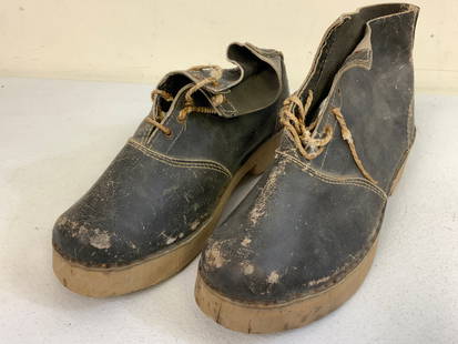 WWII NAZI GERMAN CONCENTRATION CAMP INMATE SHOES: WWII NAZI GERMAN CONCENTRATION CAMP INMATE SHOES. BLACK LEATHER LIKE MATERIAL UPPER WITH WOOD SOLES. NEVER WORN. JUST AGE AND STORAGE WEAR. RARE.