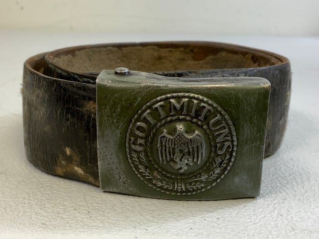 WWII GERMAN ARMY LEATHER BELT WITH BUCKLE: WWII GERMAN ARMY LEATHER BELT WITH BUCKLE. HEAVY USED SET. LEATHER IS STIFF. FIELD GREEN PAINTED WARTIME BUCKLE.