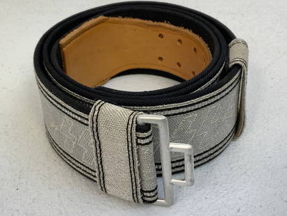 NAZI GERMANY SS OFFICERS BROCADE BELT: NAZI GERMANY SS OFFICERS BROCADE BELT. NEAR MINT CONDITION WITH ONLY SLIGHT WEAR. HIGH QUALITY SILVER BROCKADE WITH BLACK WOOL BACKING. BOTH KEEPERS ARE PRESENT. NO BUCKLE.