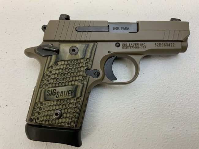 SIG SAUER P 938 TAN CAMMO PISTOL 9 MM WITH BOX AND HOLSTER: SIG SAUER P 938 TAN CAMMO PISTOL 9 MM WITH BOX AND HOLSTER .GREAT USED CONDITION WITH MINT BORE . COMES WITH TWO EXTENDED GRIP MAGAZINES , BELT CLIP MOLDED PLASTIC HOLSTER AND ORIGINAL BOX . SER # 52B