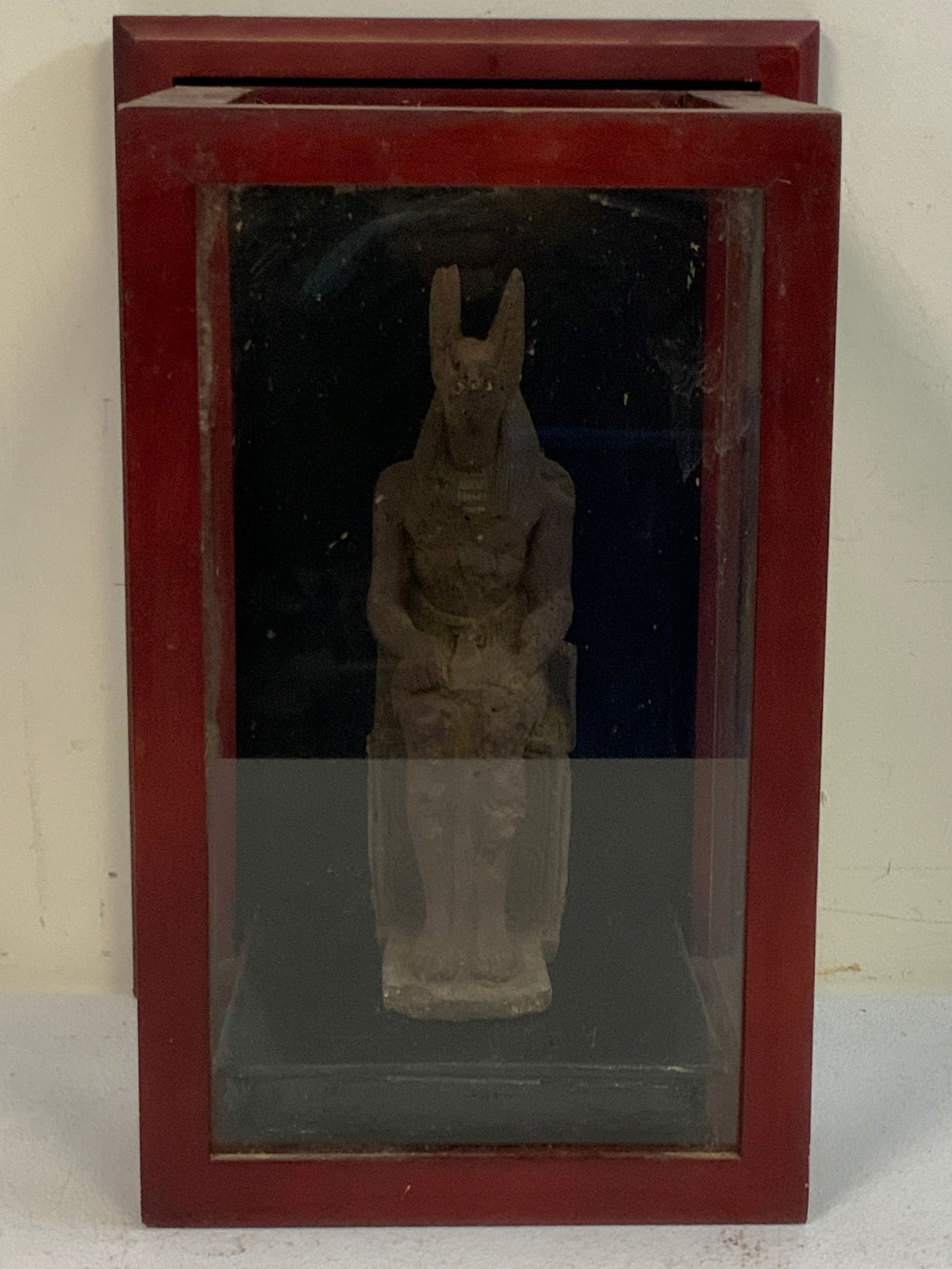ANTIQUE ANUBIS STATUE IN CASE: ANTIQUE ANUBIS STATUE IN CASE. FIRED CLAY. AGE UNKNOWN. FROM TURTURIS COLLECTION , TURIN ITALY. APROX. 9 1/2" TALL. 14 X 8 X 8 SIZE CASE. FROM DR. PAUL D WYNN COLLECTION .
